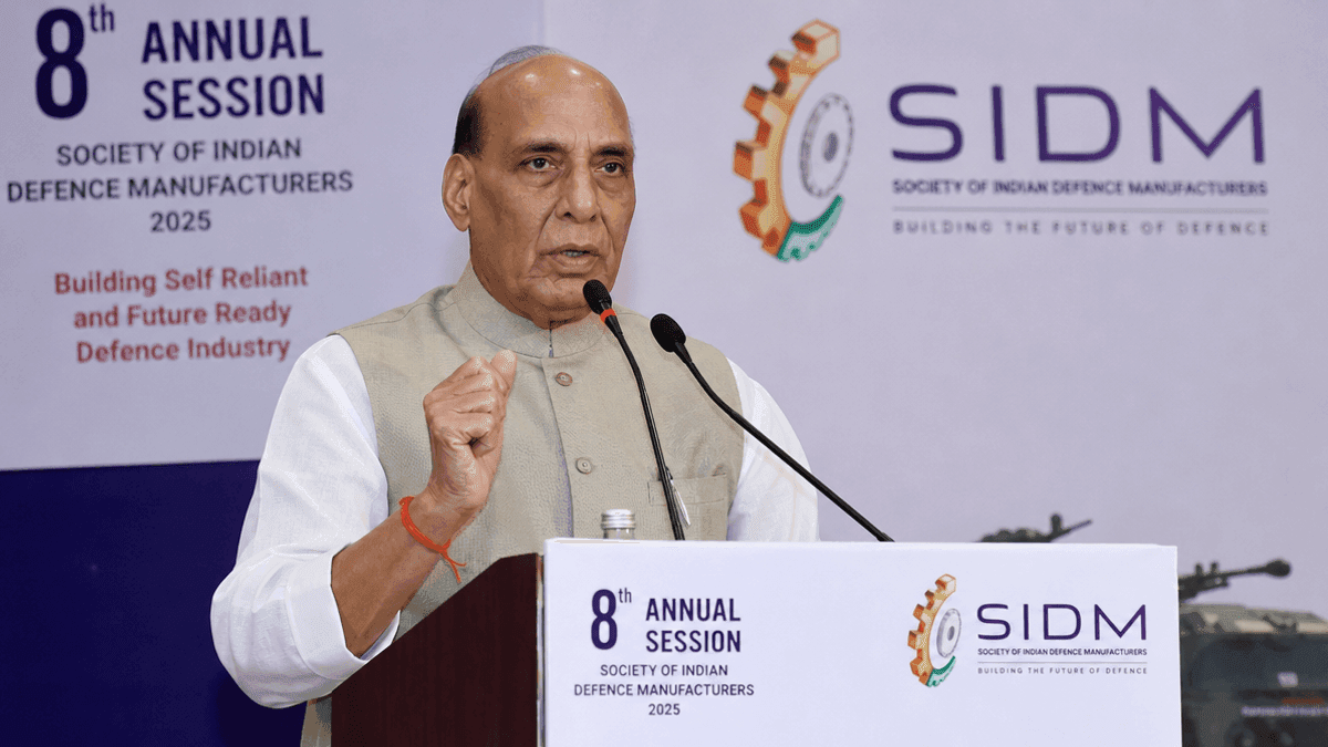 Rajnath Singh speaks at a podium during the Society of Indian Defence Manufacturers annual session.